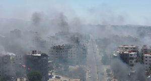 Homes still burning after mass pillaging and 30,000 trapped in besieged city – as Syria’s fragile ceasefire holds | World News