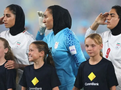 Previously silent Iran players sing and salute anthem