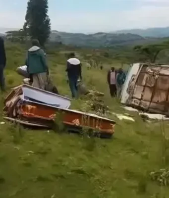 Bus En Route To Burial Overturns Leaving Coffin Destroyed & One Mourner Dead