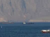 Strait of Hormuz closed again, Iran says, as ships attacked
