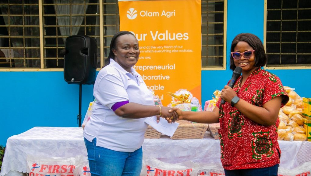 Ms-Juliet-Amuah-Vice-President-of-Olam-Agris-empOWer-hands-over-assorted-products-to-a-management-re.jpeg