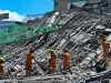 One killed and many feared trapped under collapsed building in Philippines