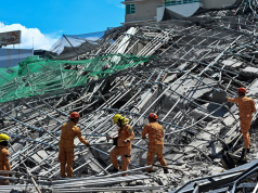One killed and many feared trapped under collapsed building in Philippines