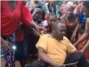 Female community members discipline husband who assaults his wife