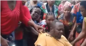 Female community members discipline husband who assaults his wife