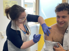 First person gets new experimental vaccine for Ebola