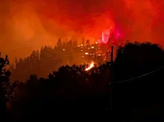 Fast-moving Canada wildfire doubles in size forcing thousands to flee homes