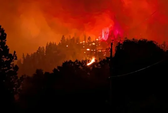 Fast-moving Canada wildfire doubles in size forcing thousands to flee homes