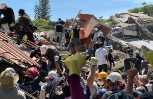 Brother of man trapped under rubble in Colombian quake clings on to hope
