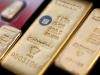 Gold rises over 1% as investors digest Fed hike, oil rally stalls
